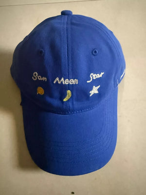 Royal blue cotton baseball cap with celestial embroidery of sun, moon, and stars.