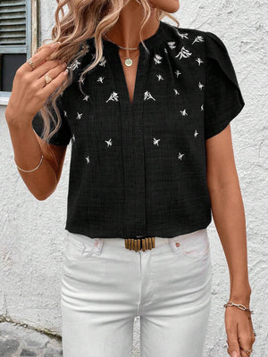 Black embroidered floral keyhole blouse with short sleeves and a V-neck.