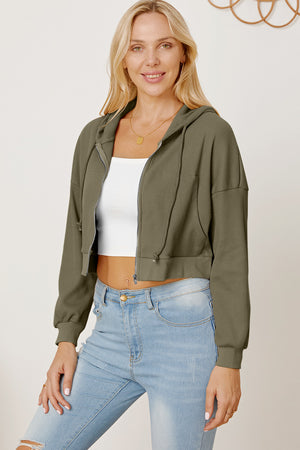 Army green waffle knit cropped zip hoodie with drawstring hood and elastic cuffs.