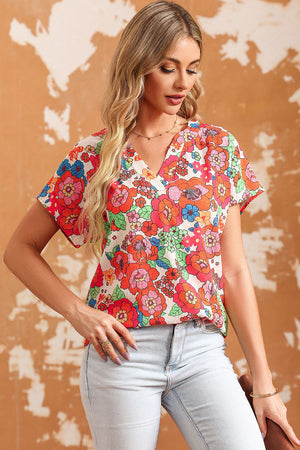 Multicolor floral print V-neck cap sleeve blouse with a casual fit.