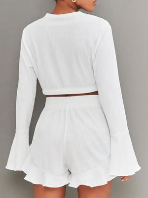 White ribbed crop set with flared sleeves and ruffled shorts