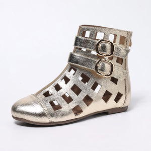 Gold cutout ankle boots with double buckle straps