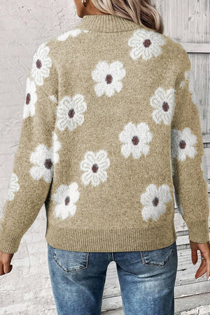 Tan acrylic mock neck sweater with allover white floral intarsia pattern.