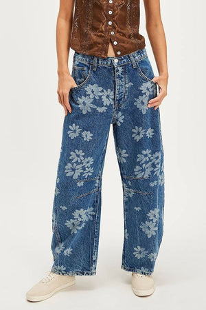 Floral print balloon denim jeans in medium wash with a relaxed fit.