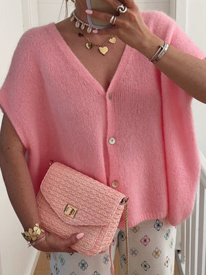 Cap sleeve mohair blend cardigan in pink with button front.