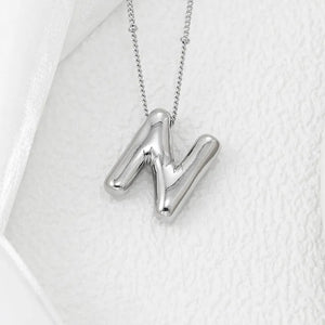 Silver letter N pendant necklace with a beaded chain