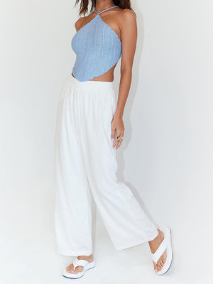 Crochet halterneck triangle top in light blue with a backless design.