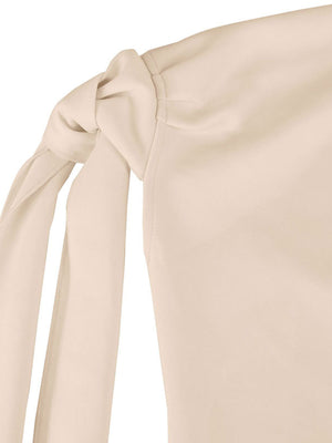 Apricot one-shoulder mini dress with a large bowknot detail on the strap.
