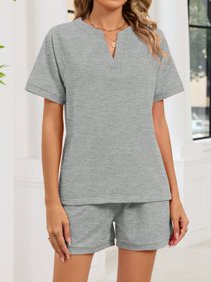 Gray two-piece loungewear set with a notched V-neck top and drawstring shorts.