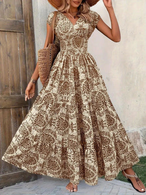 Brown flower damask print maxi dress with cap sleeves and tiered skirt.