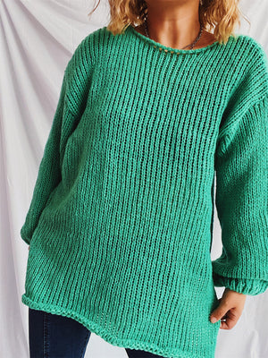 Turquoise open-knit acrylic boatneck sweater with slouchy fit and ribbed cuffs.