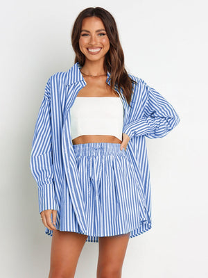 Light blue and white striped oversized shirting set with drawstring shorts.