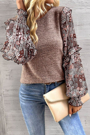 Knit top with floral chiffon bishop sleeves and ruffled cuffs.