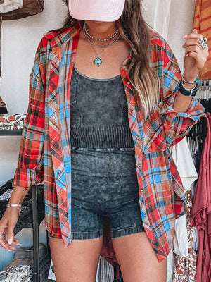Oversized plaid shacket in red, blue, and orange with a relaxed fit, open front and long sleeves.