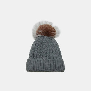 Dark Gray acrylic cable knit beanie with a fluffy pompom.
