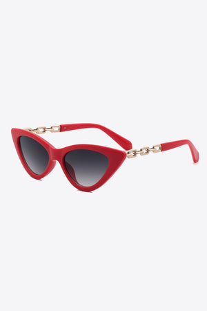 Chainlink cat-eye sunglasses in deep red with gold chain detail and gradient lenses