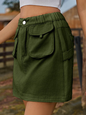 Dark green denim mini skirt with elastic waist and button, featuring multiple cargo pockets.