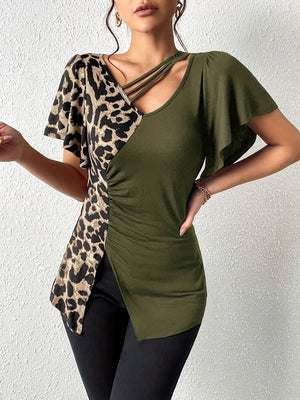 Moss green asymmetric top with leopard print panel, cutout neckline, and ruched detail.