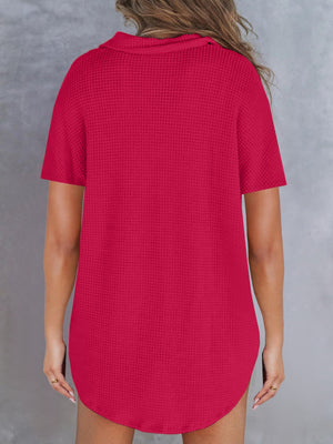 Waffle knit polo shirt in deep rose with short sleeves and button detail.