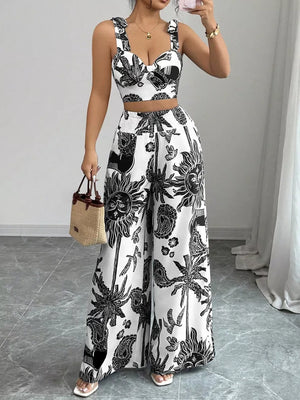 Black and white tropical print crop top and wide-leg pants set with tie straps.