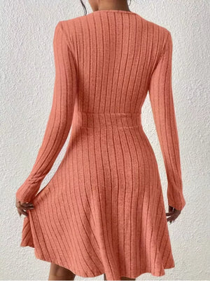 Burnt Coral ribbed texture wrap mini dress with long sleeves and A-line skirt.