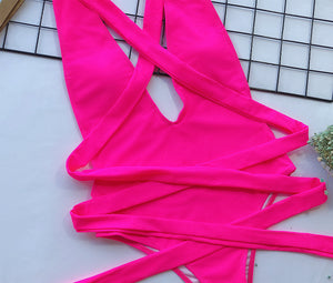Hot pink wrap-around halterneck plunge swimsuit with crisscross ties