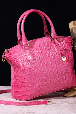 Fuchsia pink crocodile embossed satchel bag with top handles and gold hardware.