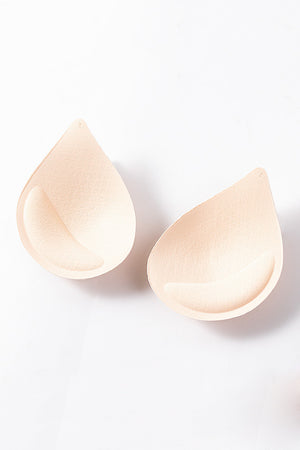Apricot teardrop bra inserts with textured surface