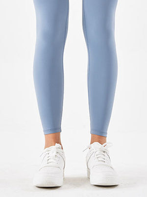 Misty Blue high-waist leggings with white sneakers