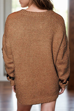 Taupe knit sweater with sequin embellishments on the cuffs.