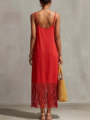 Red maxi dress with spaghetti straps and fringe hem detail.