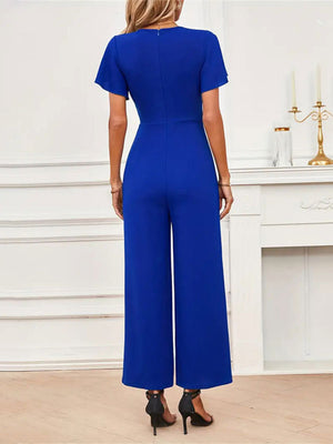 Royal blue flutter sleeve wide-leg jumpsuit with a V-neck and back zipper.
