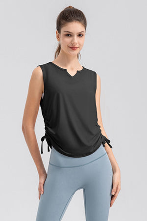 Black active tank top with notched neckline and adjustable side ruching detail.