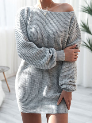 Grey balloon sleeve sweater dress with off-the-shoulder neckline and ribbed knit detail.
