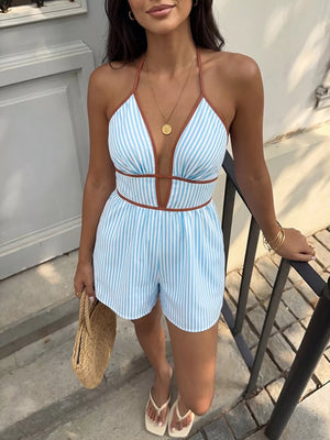 Blue striped halter romper with deep V-neck and brown trim.