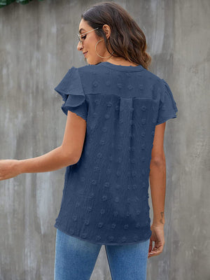 Textured voile blouse in dark blue with flutter sleeves and dotted pattern.
