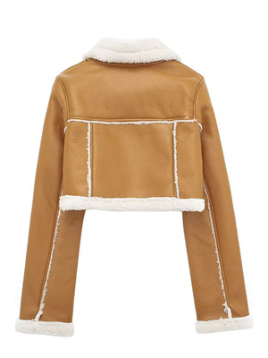 Brown cropped aviator jacket with white shearling trim and collar.