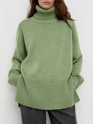 Matcha green ribbed turtleneck sweater with flared sleeves and a relaxed fit.
