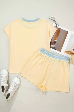 Yellow cotton color block crew neck t-shirt and shorts set with blue trim.