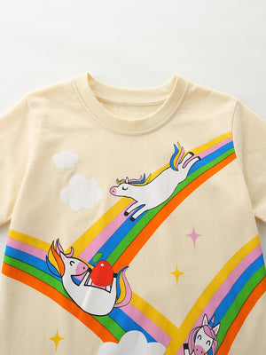 Cream cotton t-shirt with playful unicorns on a rainbow graphic, clouds, and stars.