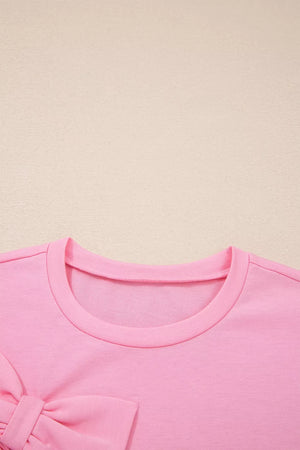 Solid Color Raw Edge Bow Patch Loose T Shirt in Pink, back view