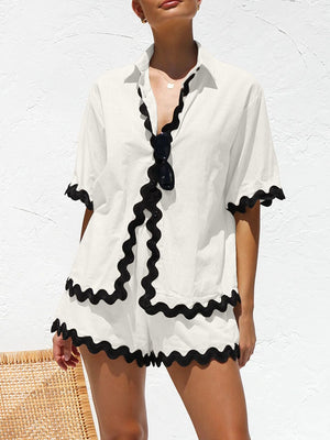 White linen co-ord set with black scalloped trim and short sleeves