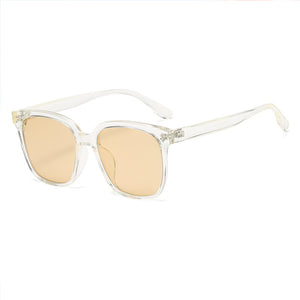 Chic square gradient tint sunglasses with clear frames and peach lenses.