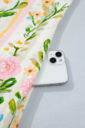Floral print shift dress with pink and yellow stripes, showing a pocket detail.