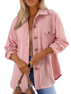 Blush pink textured oversized button-down shacket with buttoned pockets and collar.