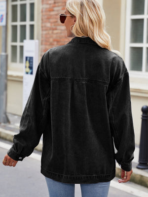 Black denim oversized shacket with button cuffs and collar detail.