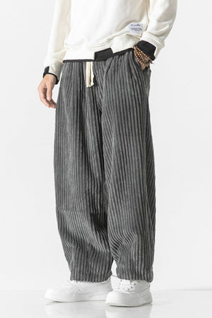 Gray corduroy wide-leg cargo pants with a relaxed fit and drawstring waist.