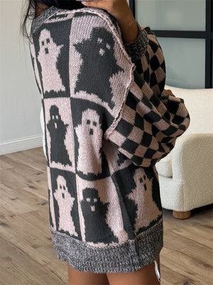 Ghost checkered knit sweater in dusty pink and black with ghost pattern and checkered sleeves.