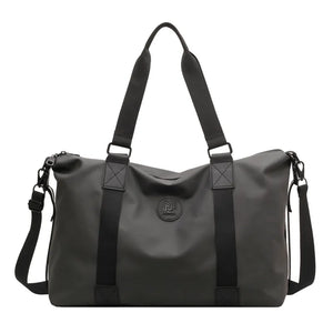 Urban Utility Weekend Bag in dark gray canvas with black straps and logo detail.