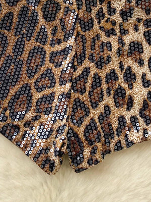 Radiant animal print sequin chino shorts with a leopard pattern.
